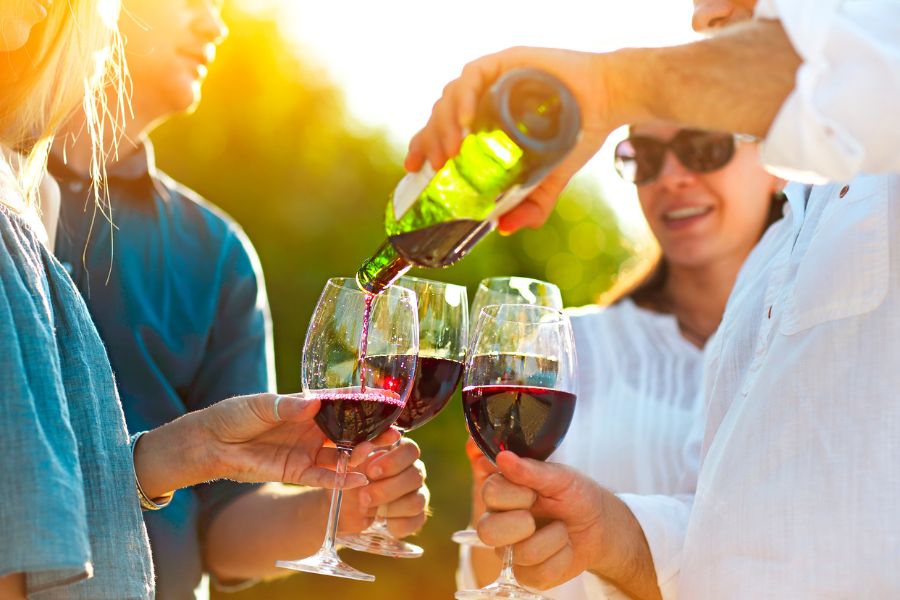 Guests enjoying a wine tasting at an outdoor festival