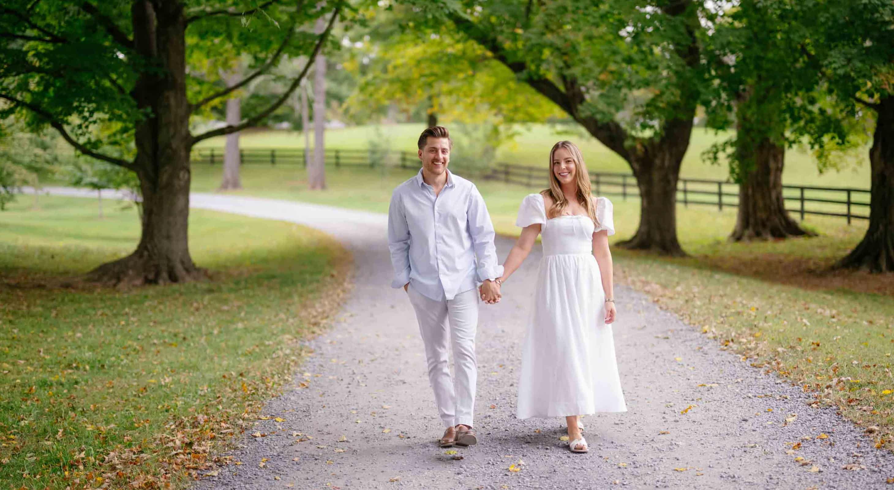 Couple walking down the road after proposal near Glen Gordon Manor