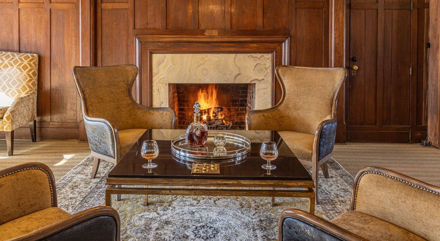 Cozy fireplace and library with Blue Ridge Mountain winter views at Glen Gordon Manor