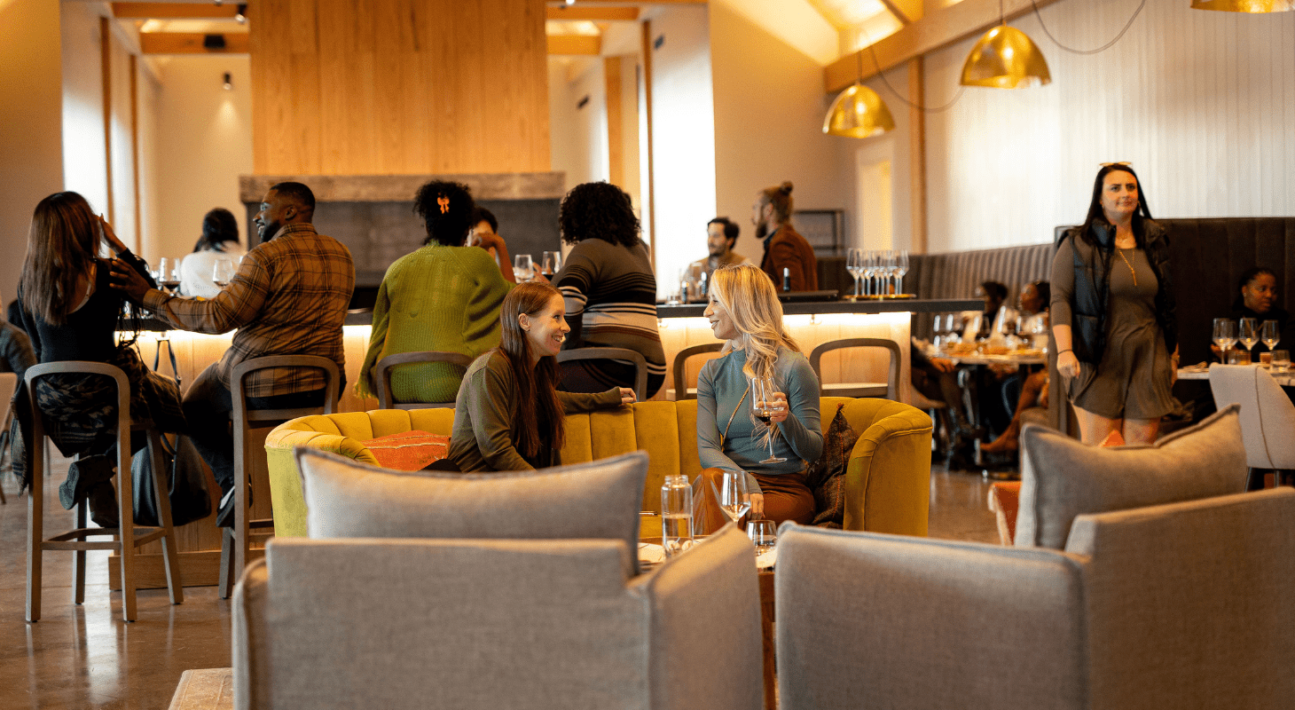 women talking and enjoying wine at Crimson Lane Vineyards