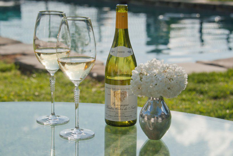 wine glasses poolside