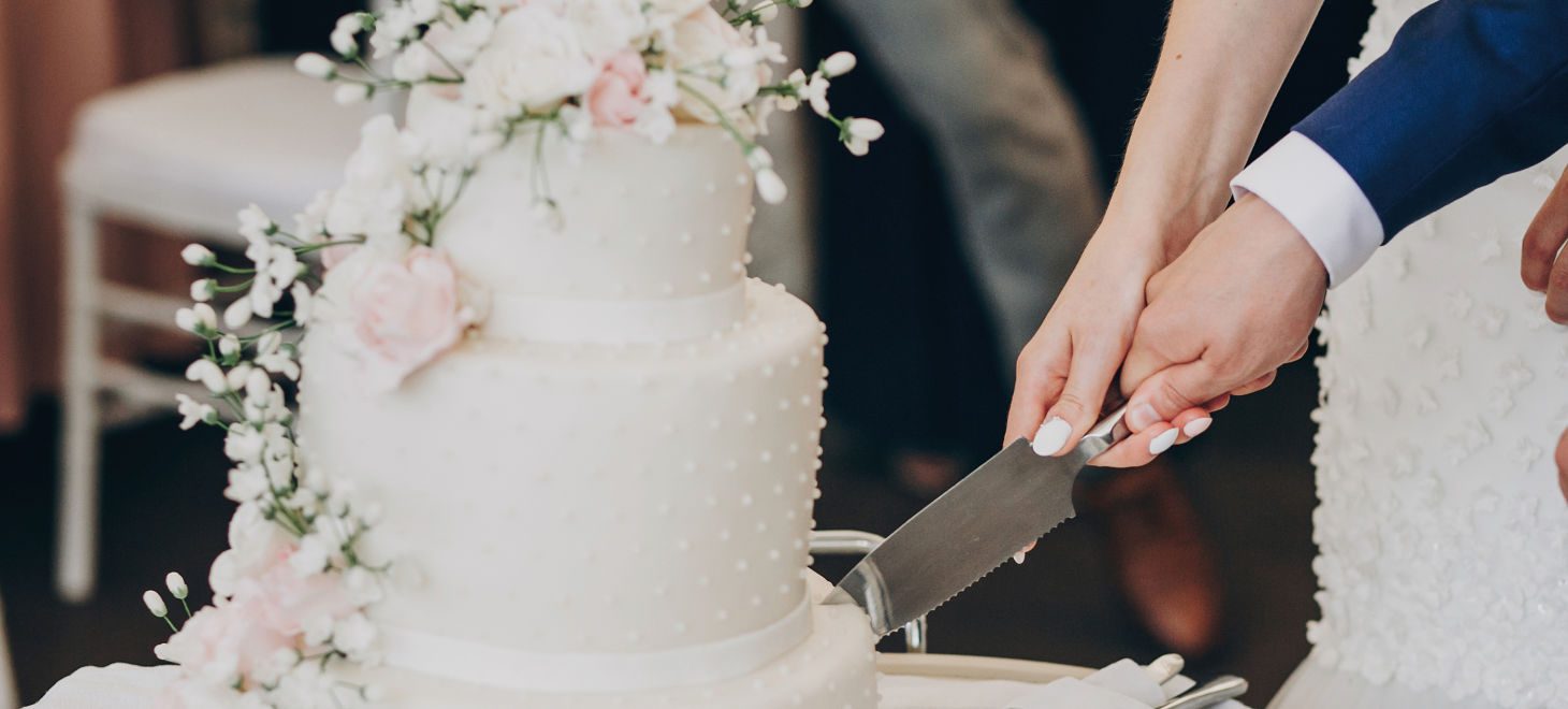 Bride And Groom Holding Knife And Cutting Stylish White Wedding