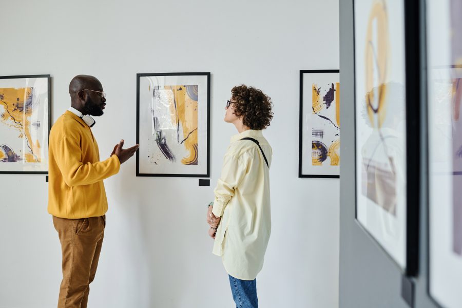 a couple discussing Shenandoah Valley art at a gallery