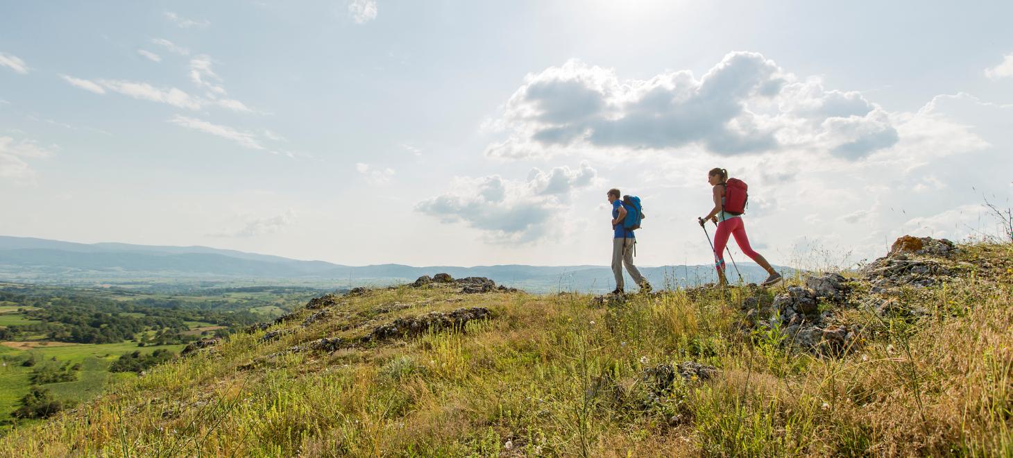 Couple hiking on the ridge of a mountain