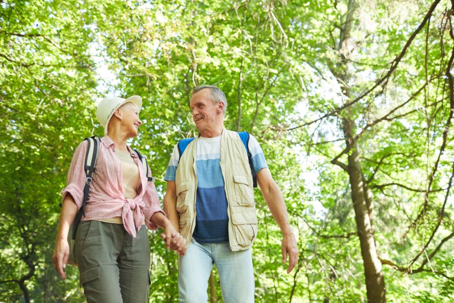 senior couple doing an easy hike in the national forest