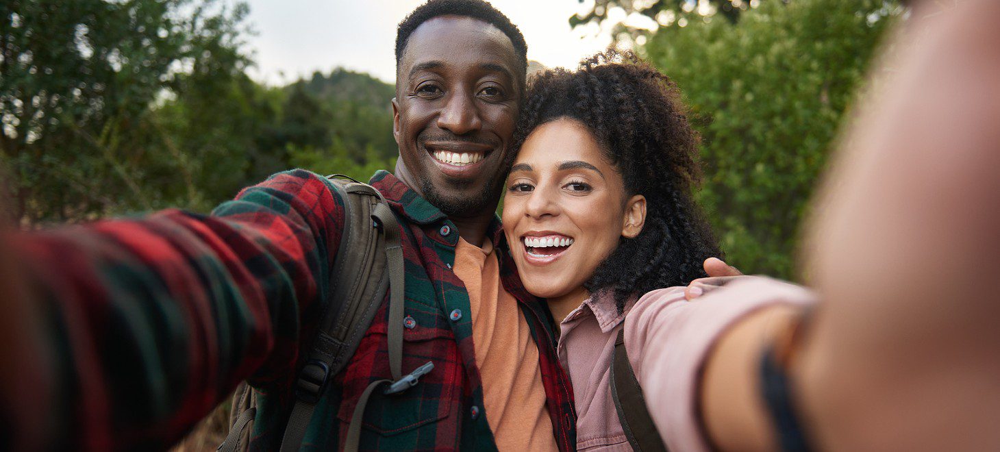 couple taking a selfie during a hike during a fall getaway from DC