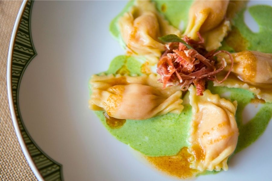 Ravioli with prosciutto and green sauce at Houndstooth Restaurant during private holiday dining in Virginia